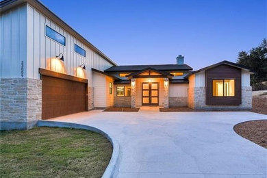 Inspiration for a multicolored one-story mixed siding house exterior remodel in Austin
