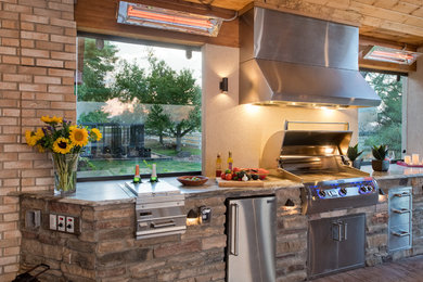 Example of a mountain style patio design in Denver
