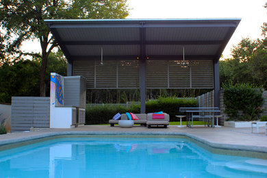 Large minimalist backyard concrete patio photo in Austin with a gazebo