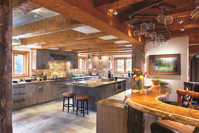 Example of a mid-sized mountain style u-shaped kitchen design in Los Angeles with an undermount sink, flat-panel cabinets, medium tone wood cabinets, marble countertops, beige backsplash, mosaic tile backsplash, stainless steel appliances and two islands
