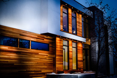 Example of a large minimalist exterior home design in Calgary