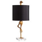 Cyan Design - Ancient Gold Ibis Table Lamp - A long-legged ibis is the stunning centerpiece of this decorative table lamp. Beautiful in any space, this lamp features a warm ancient gold finish over detailed resin construction. A black satin drum shade is lined in gold, ensuring inviting illumination for a favorite sitting area. This charming bird holds a crystal sphere in its talon, and rests on a acrylic base that delivers a touch of luxurious flair. It measures 35"H x 14.5"Dia and weighs 11 lbs. It takes a 100 Watt bulb.
