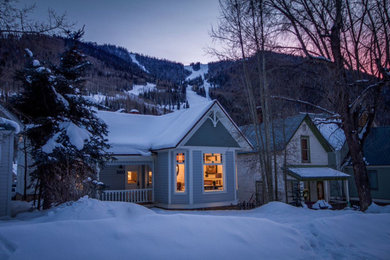 Small traditional blue two-story wood gable roof idea in Denver