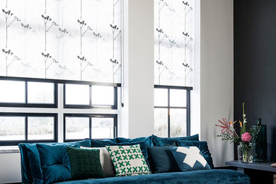 Photo of a contemporary formal living room in Copenhagen with black walls and black floor.