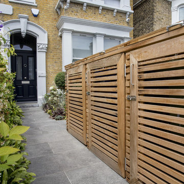 A modern, enclosed front garden driveway
