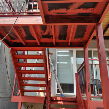 Metal porch refinishing. Rust removal, prming and painting.