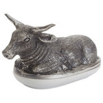 Indigo Retreat - Cow Butter Dish - Keep your butter fresh and soft with the Steer Butter Dish. Crafted from porcelain and featuring an impressive polished nickel steer topper, this piece provides all the function of a butter dish while also giving your kitchen space an attractive piece of decor to display on your counter. Measures at 8.5 inches long, 5 inches wide and 4.5 inches high.