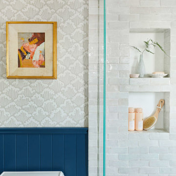 emily henderson's classic modern master bathroom with weathered white subway