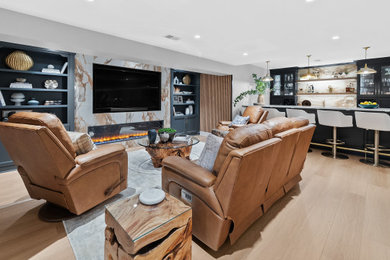 Basement - large transitional walk-out vinyl floor, brown floor, coffered ceiling and wall paneling basement idea in Other with a home theater, beige walls, a standard fireplace and a tile fireplace