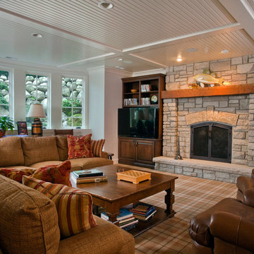 English Basement Family Room with Stone Fireplace and Beadboard Ceiling