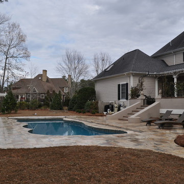 Fiberglass Swimming Pool with Travertine Decking and Automatic Cover
