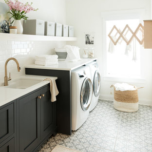 Traditional single-wall separated utility room in Charlotte with a submerged sink, shaker cabinets, black cabinets, white walls, a side by side washer and dryer, multi-coloured floors and white worktops.