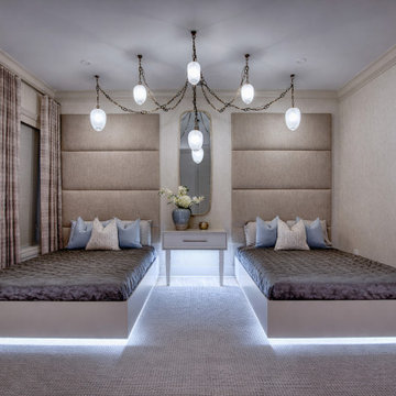 Dual Bedroom with Custom Upholstered Wall Panels and Statement Lighting