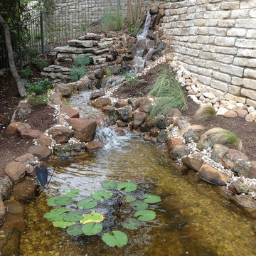 Todd's Pond and Waterfall Through the Retaining Wall