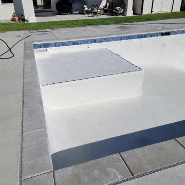 WHITE PLASTER BLUE TILE