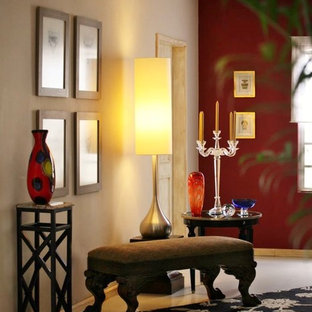 Large eclectic entry hall in Austin with red walls.