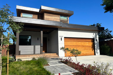 Example of a large trendy white three-story wood exterior home design in San Francisco with a black roof