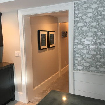 A fully equipped laundry room with a built ins