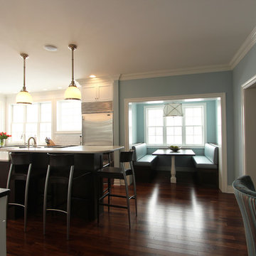 Bright White Kitchen with Floating Shelves and Dark Stained Island