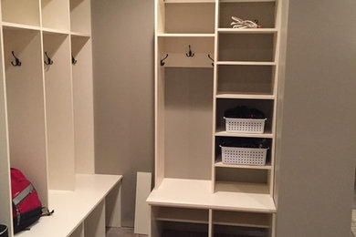Mudroom - mid-sized traditional porcelain tile and multicolored floor mudroom idea in Other with beige walls
