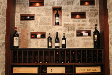 Huge tuscan slate floor wine cellar photo in Ottawa