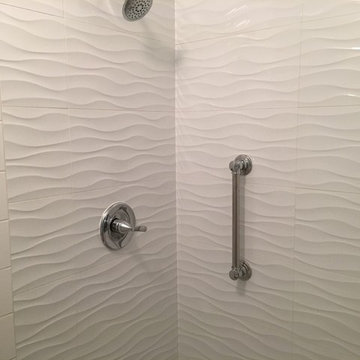 Fiberglass shower replacement with tile shower.