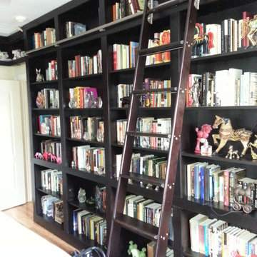 Built-in Bookcases with Rolling Ladder and Hidden Vault