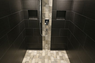 Mid-sized trendy black tile and porcelain tile beige floor bathroom photo in Calgary with black walls