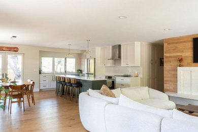 Inspiration for a mid-sized 1950s open concept light wood floor living room remodel in Salt Lake City with a standard fireplace and a wall-mounted tv