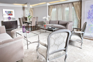 Inspiration for a large contemporary formal and open concept medium tone wood floor and brown floor living room remodel in New York with gray walls, no fireplace and no tv