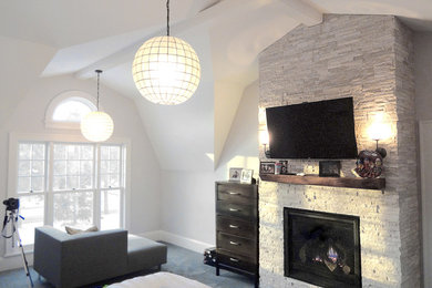 Example of a huge classic master carpeted bedroom design in Minneapolis with blue walls, a standard fireplace and a tile fireplace