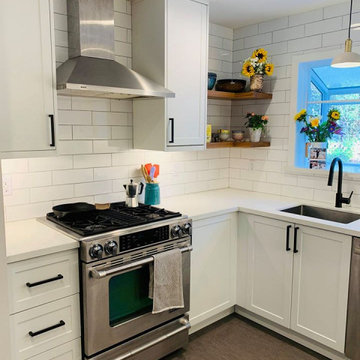 ikea white cabinets with subway tile backsplash and floating shelves