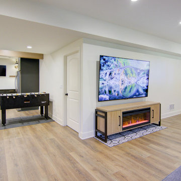 Warm & Inviting Basement Retreat with Kitchenette and Reading Nook