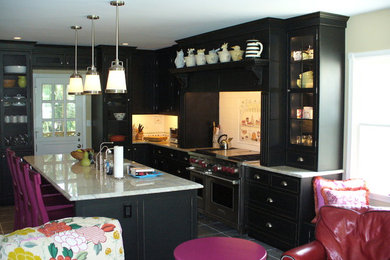 Example of a mid-sized minimalist l-shaped slate floor kitchen design in Baltimore with an undermount sink, shaker cabinets, black cabinets, granite countertops, white backsplash, ceramic backsplash, stainless steel appliances and an island