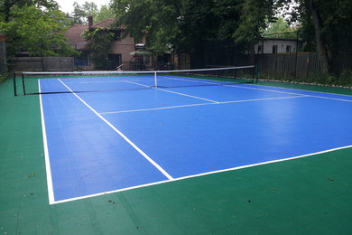 Photo of a large traditional partial sun backyard concrete paver landscaping in Toronto for spring.