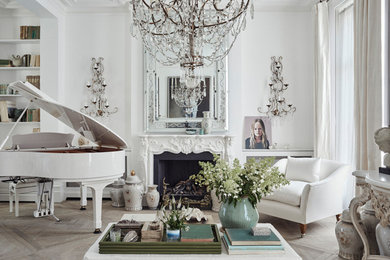 Design ideas for a large classic formal and grey and white open plan living room in London with white walls, medium hardwood flooring, a standard fireplace, a stone fireplace surround, a concealed tv, grey floors and a chimney breast.