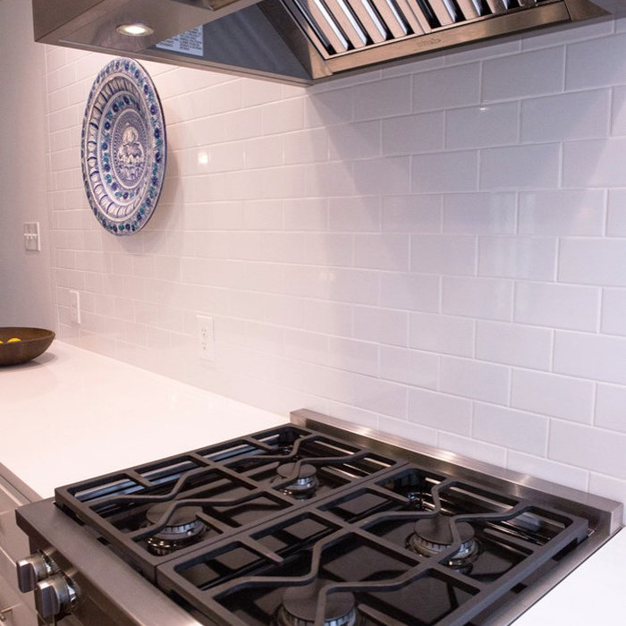 Full kitchen remodel in the Dallas neighborhood of Lakewood Heights 75214, including custom paint-grade wood cabinetry, 3CM quartz countertops, white porcelain subway tile backsplash, Miele stainless