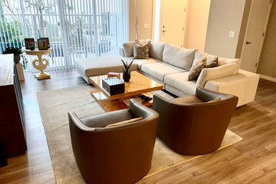 Mid-sized minimalist open concept ceramic tile and gray floor living room photo in Other with white walls, no fireplace and a tv stand