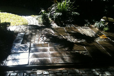 Inspiration for a courtyard shaded outdoor sport court for spring in Brisbane with concrete pavers.