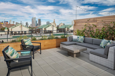 This is an example of a contemporary rooftop concrete paver landscaping in New York.