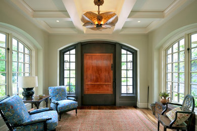 Design ideas for a mid-sized asian foyer in Seattle with medium hardwood floors and a single front door.