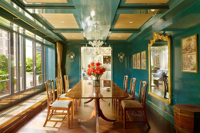 Design ideas for a traditional separate dining room in New York with medium hardwood floors and blue walls.