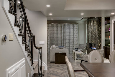 Living room - mid-sized transitional open concept porcelain tile living room idea in Los Angeles with gray walls, a ribbon fireplace, a stone fireplace and no tv