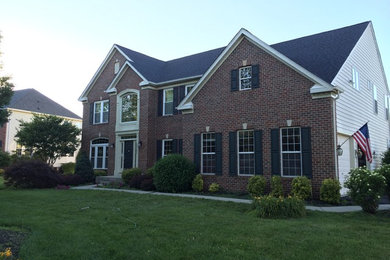 Large elegant multicolored two-story mixed siding exterior home photo in Baltimore with a shingle roof