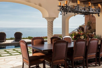 Inspiration for a contemporary backyard stone patio remodel in Orange County