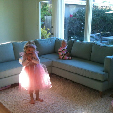 Green Sofa with Kids in Garden Room | The Sofa Company