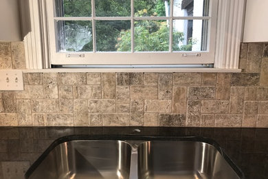 Trendy l-shaped kitchen photo in Cincinnati with granite countertops, stone tile backsplash and no island