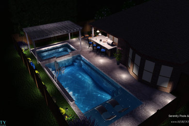 Modelo de piscinas y jacuzzis naturales tradicionales de tamaño medio rectangulares en patio trasero con adoquines de piedra natural