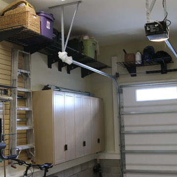 Deep, single wide garage features work bench and exercise area