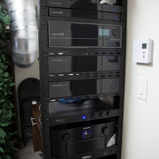 Inspiration for a medium sized contemporary open plan home cinema in Montreal with white walls, plywood flooring and a wall mounted tv.